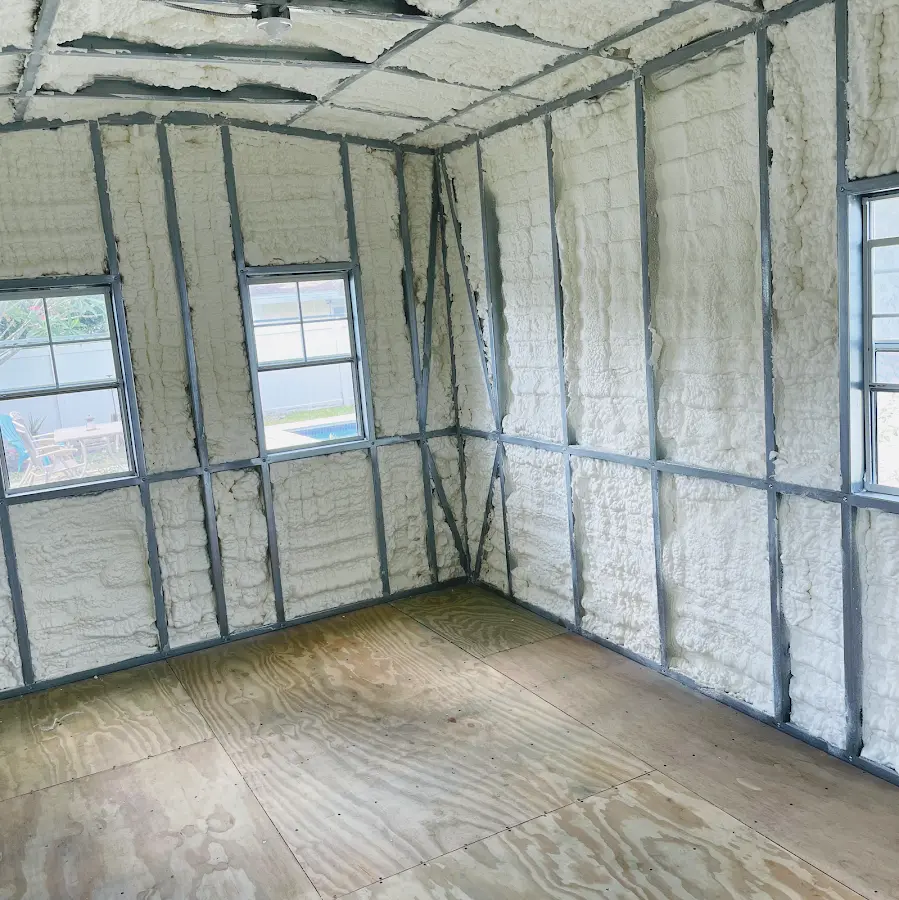 Closed-cell spray foam insulation applied to wall cavities in a residential project in Nelson